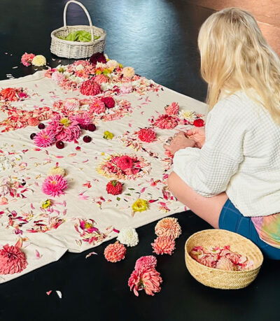 women-sitting-and-working-to-add-to-a-grief-altar-and-mandala